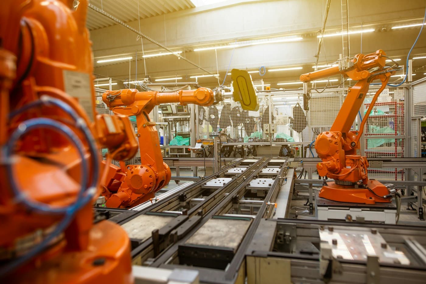 Industrial robots inside an automotive assembly plant